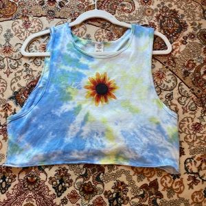 This is a urban outfitters size large cropped tank top. It has NEVER been worn.